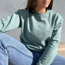 Load image into Gallery viewer, Sage green sweatshirt with white logo across chest
